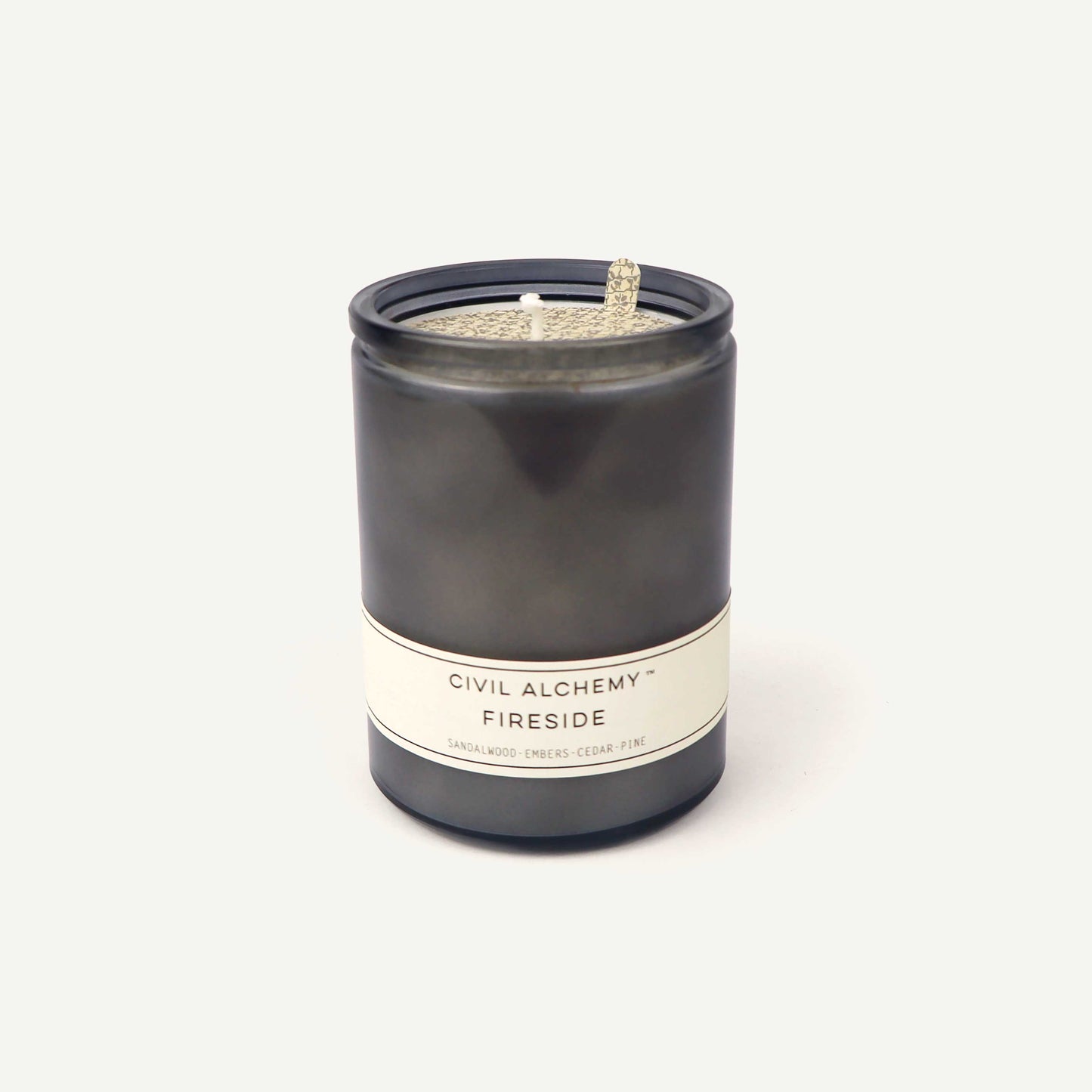 Gray candle with a label on a white background