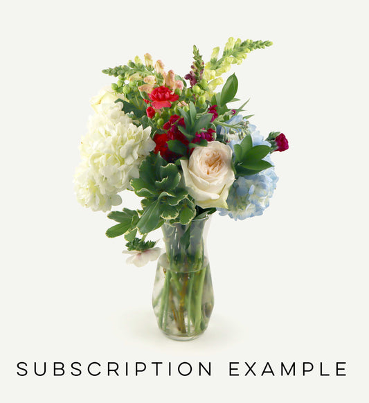 Bouquet of flowers in a clear vase on a white background with 'Subscription Example' text.