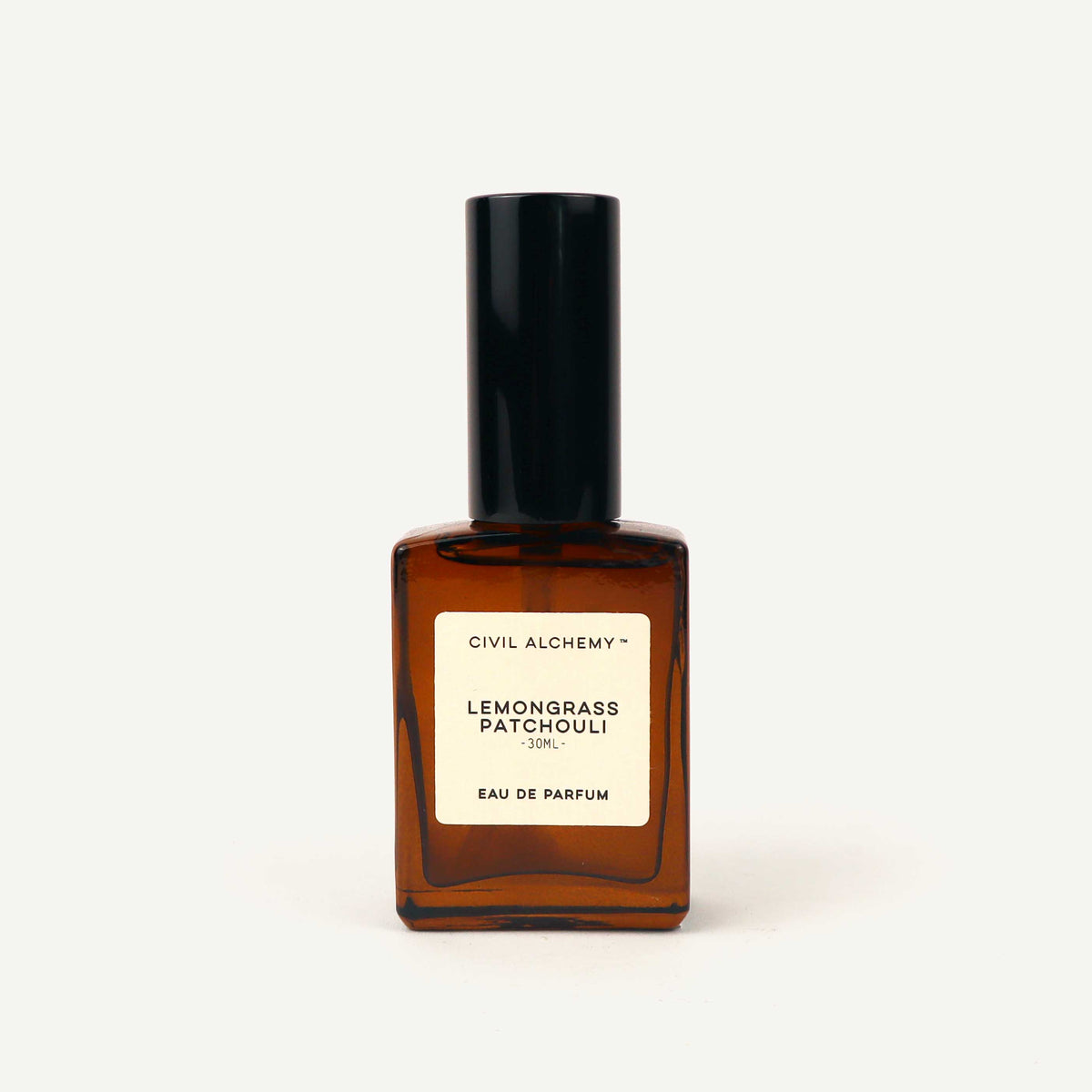 Brown perfume bottle with black cap on a white background