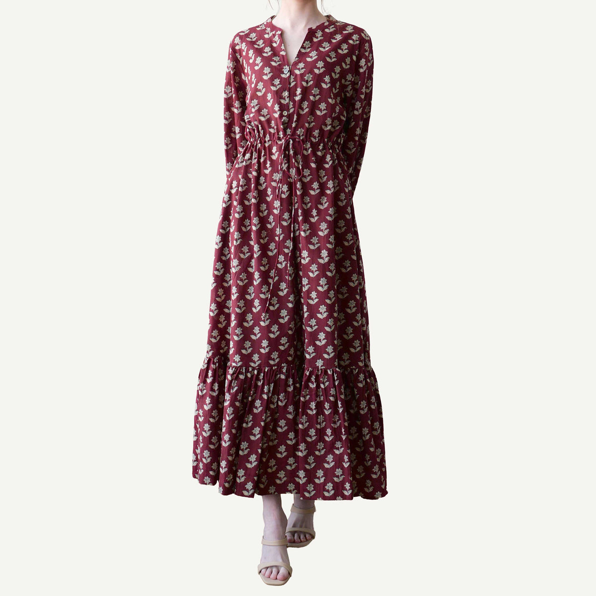 Maroon floral dress on a white background