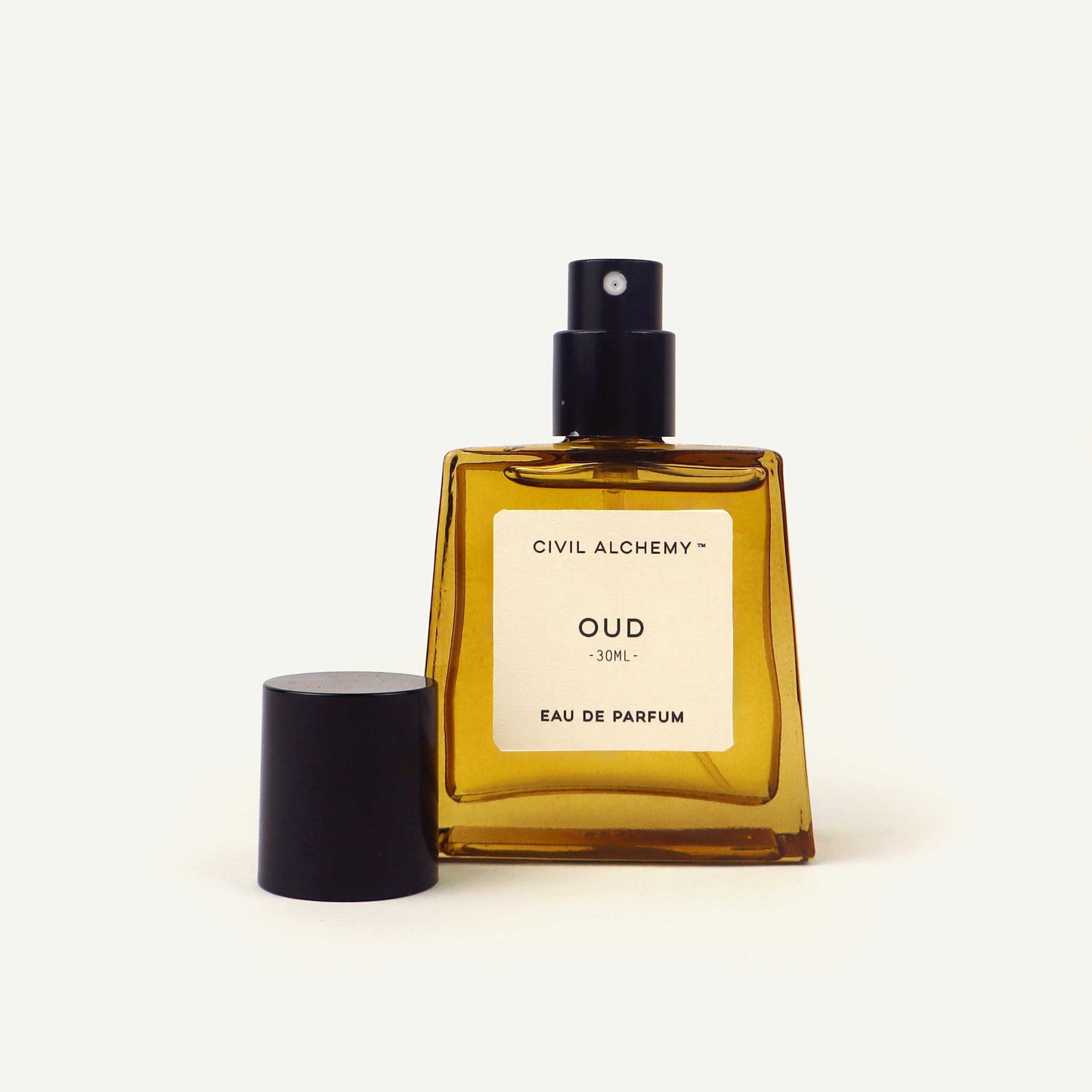 Perfume bottle labeled 'Oud' by Civil Alchemy on a white background