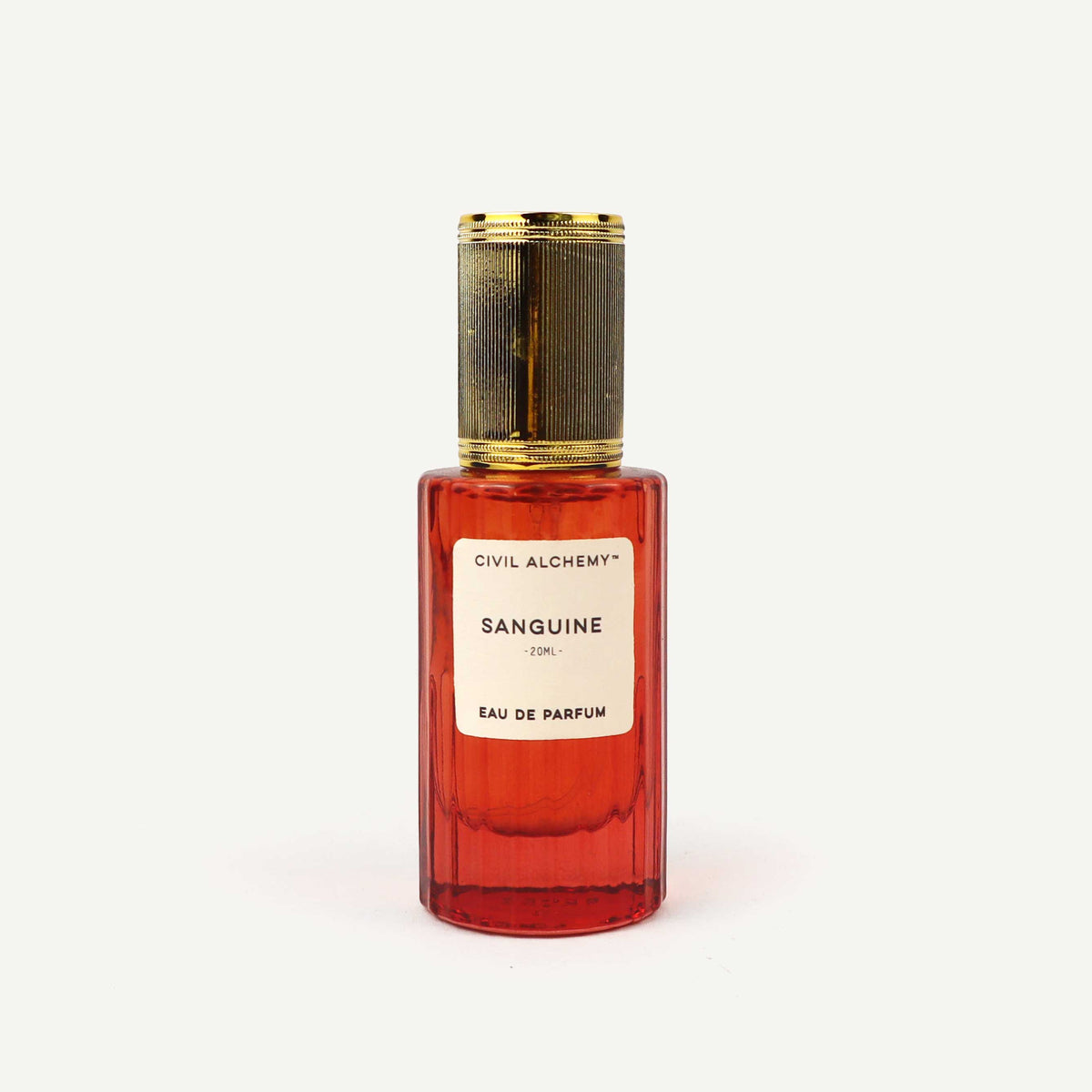 Red perfume bottle with gold cap on a white background