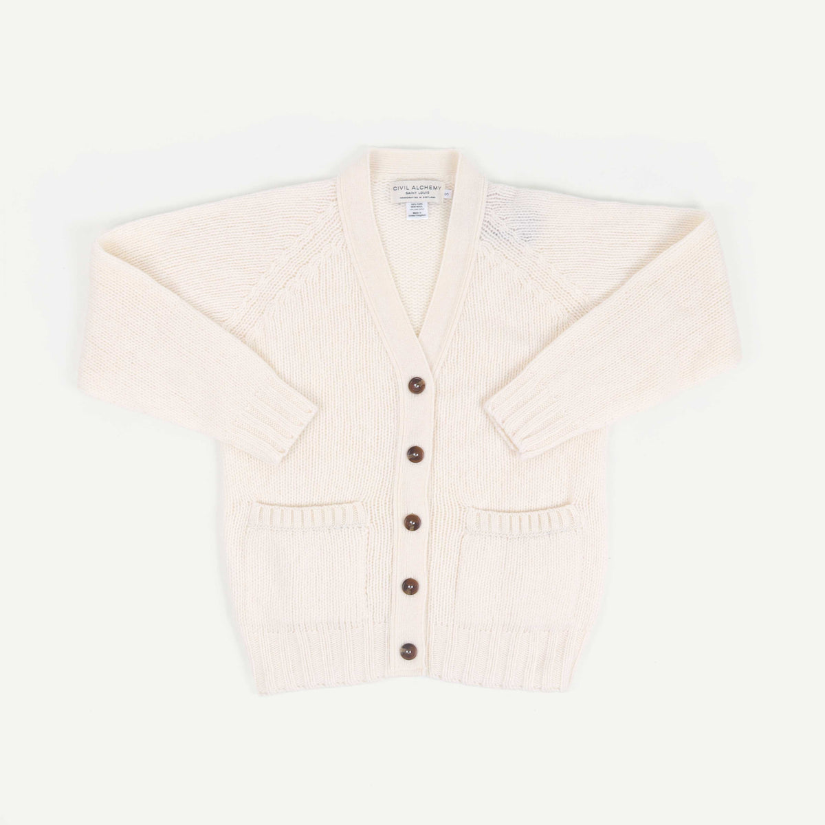 Cream-colored cardigan with brown buttons on a white background