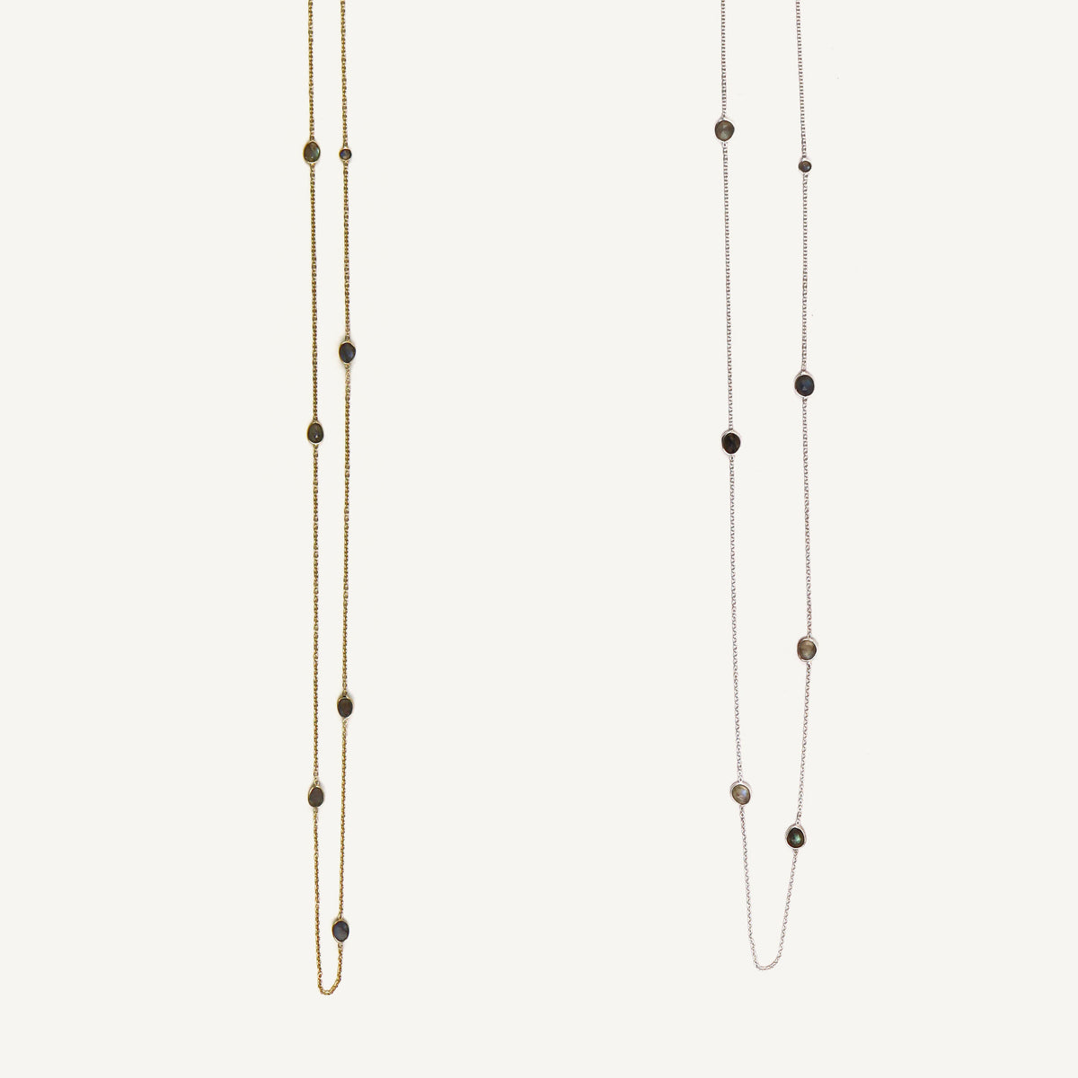 Two long beaded necklaces on a white background