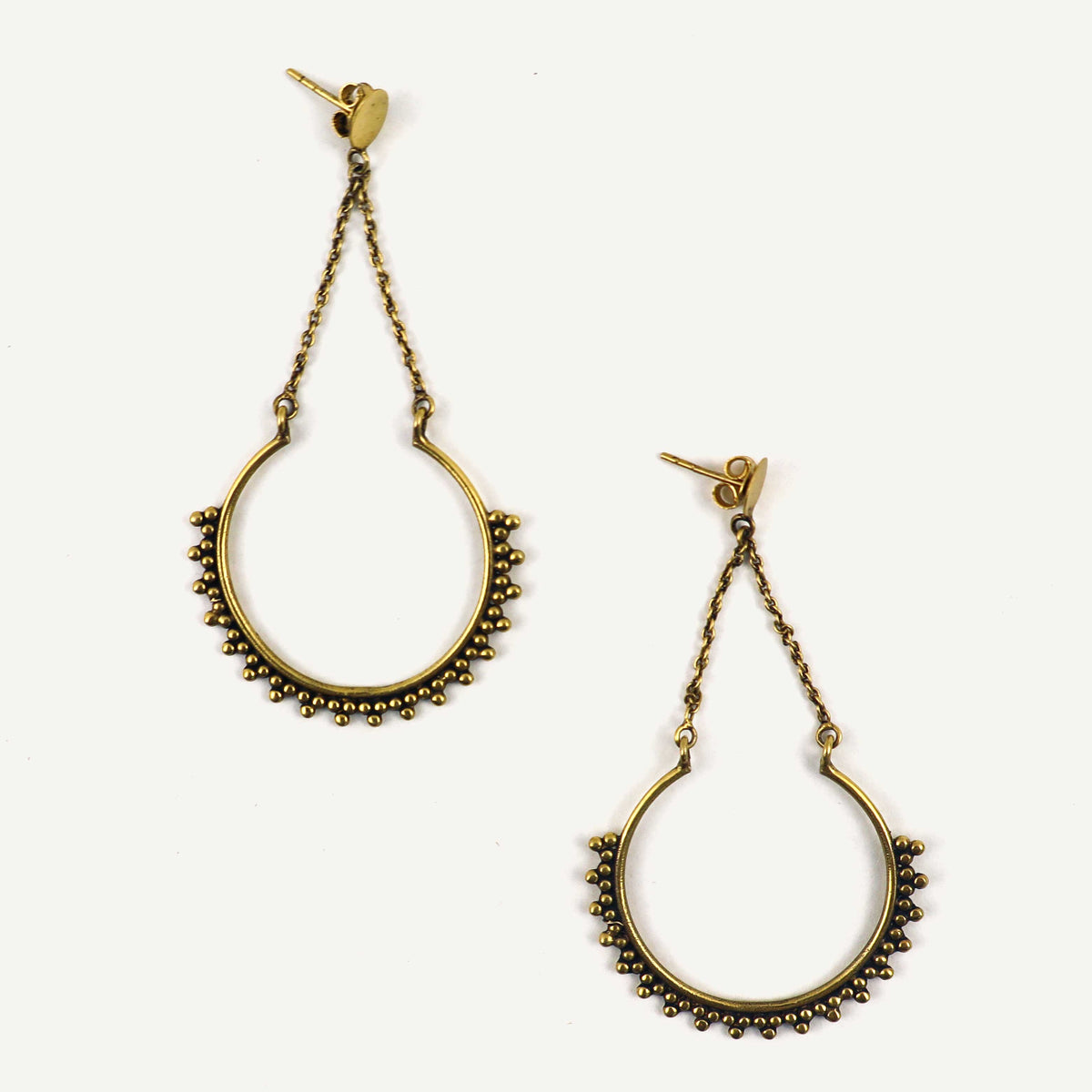 Pair of gold hoop earrings with chain details on a white background
