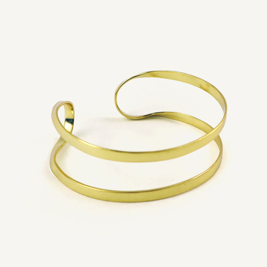Gold bangle on a white background