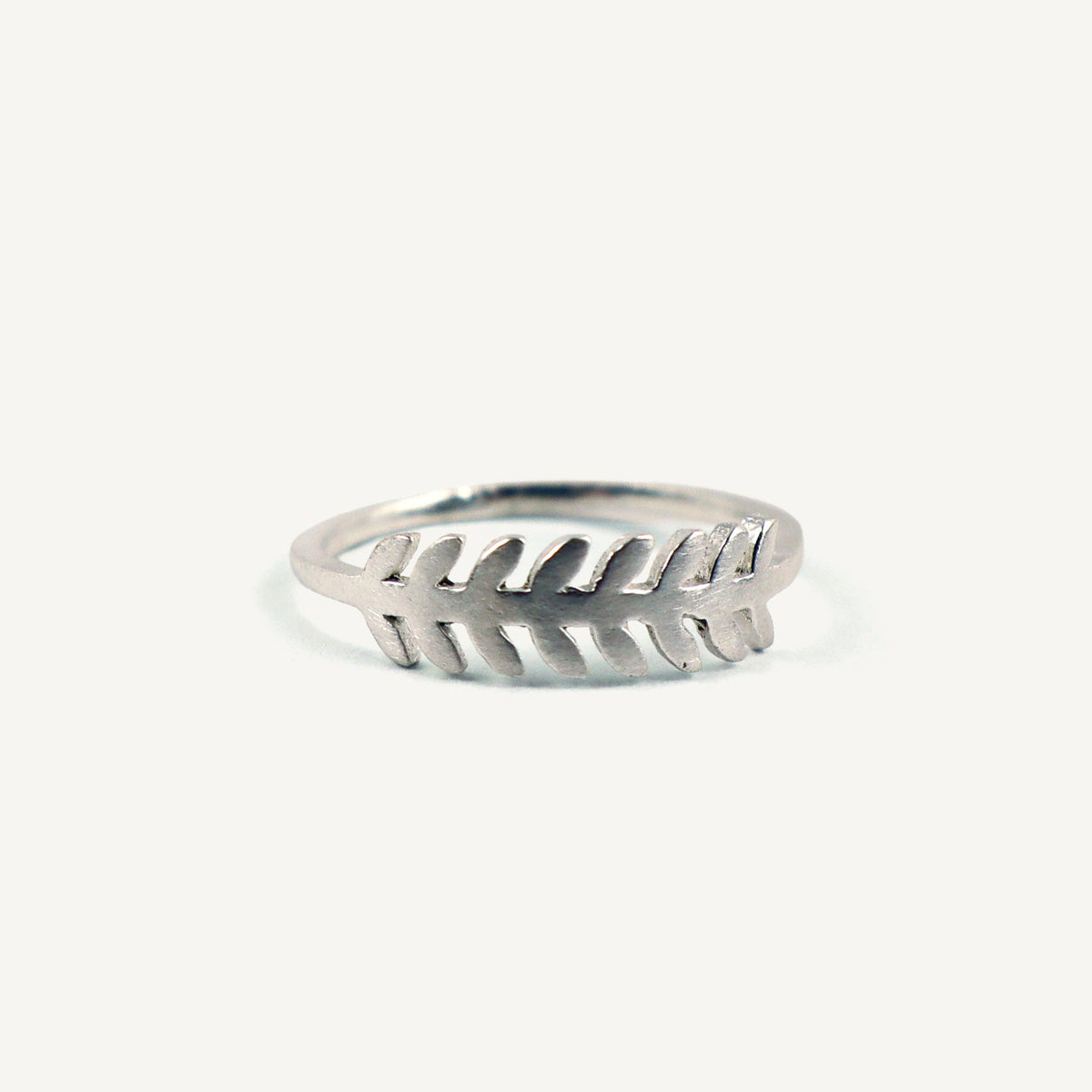 Silver ring with a unique design on a white background