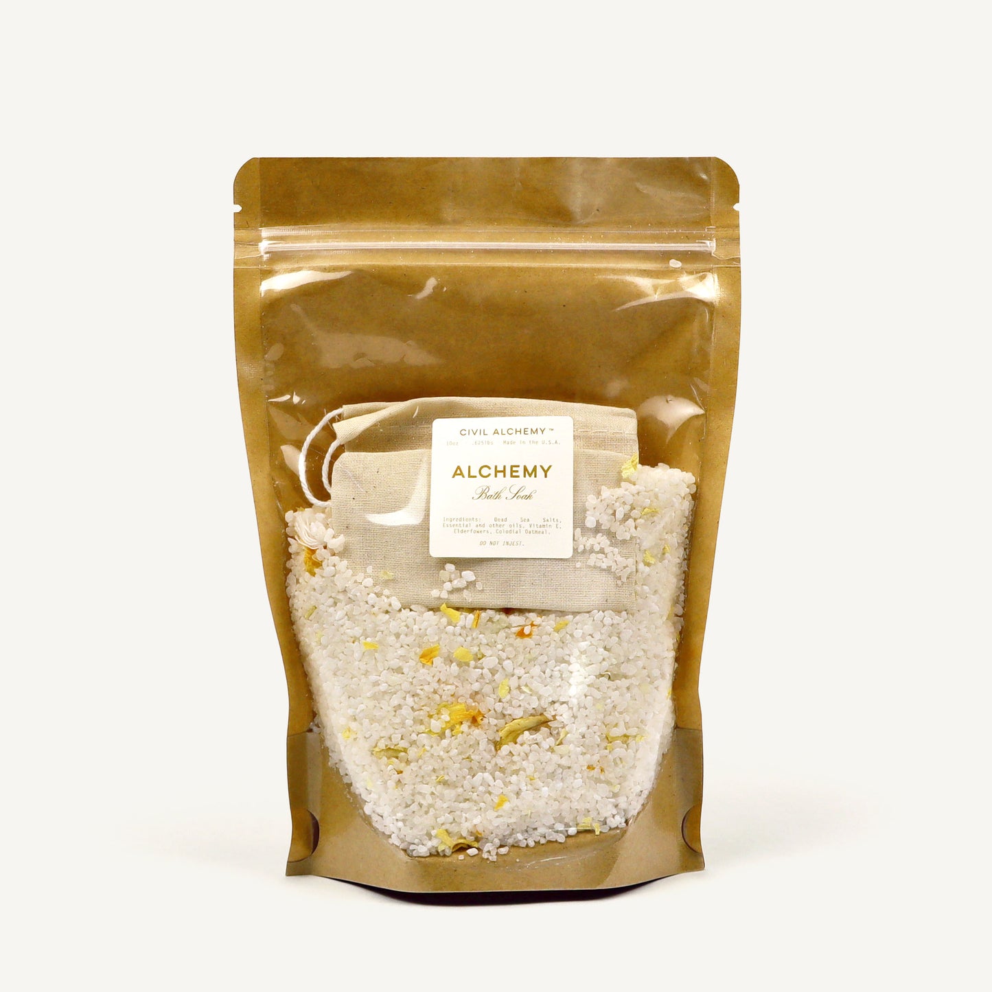 Brown packaging of bath salt with 'Alchemy' label on a white background