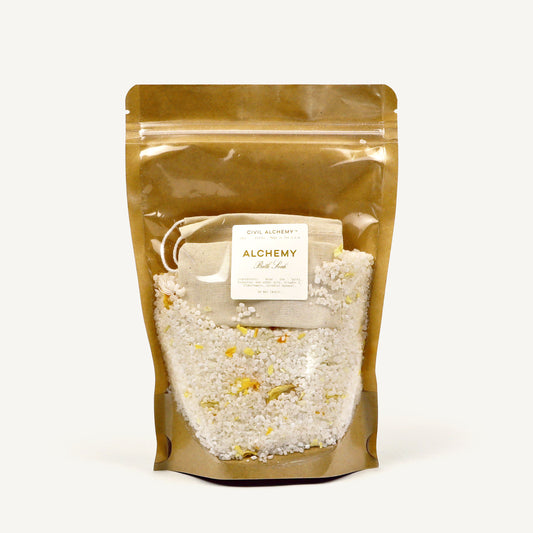 Brown packaging of bath salt with 'Alchemy' label on a white background