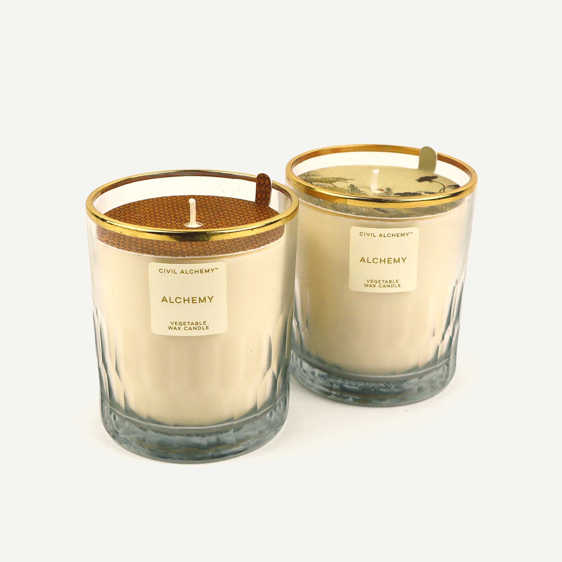 Civil Alchemy candles in scent "Alchemy". Both candle covers present on a white background.