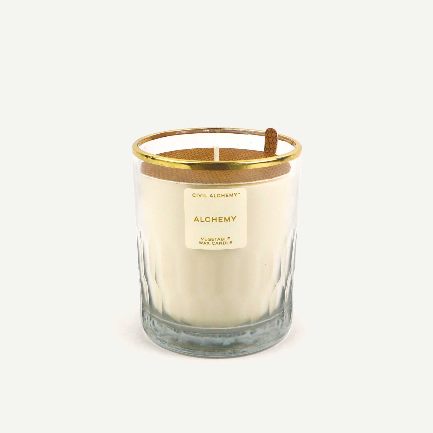 Candle with gold lid and label on a white background