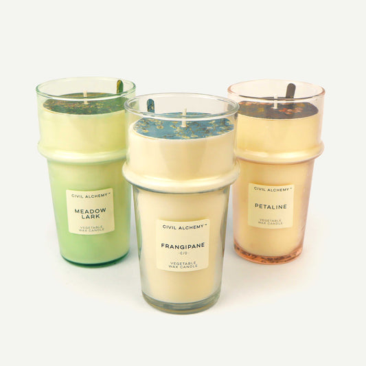 Three candles with labels on a white background
