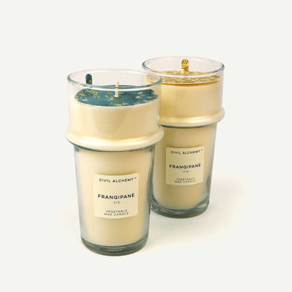 Two Civil Alchemy candles with labels on a white background