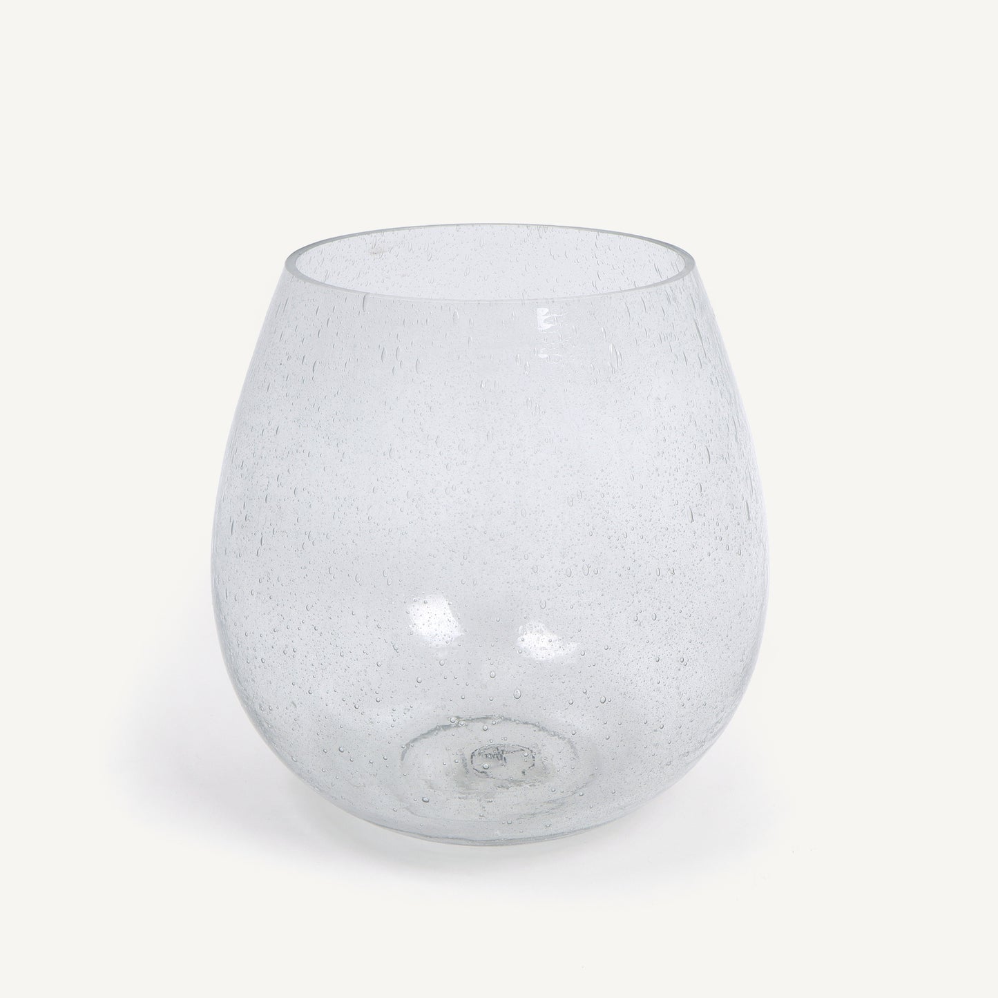 Clear glass vase with speckled pattern on a white background