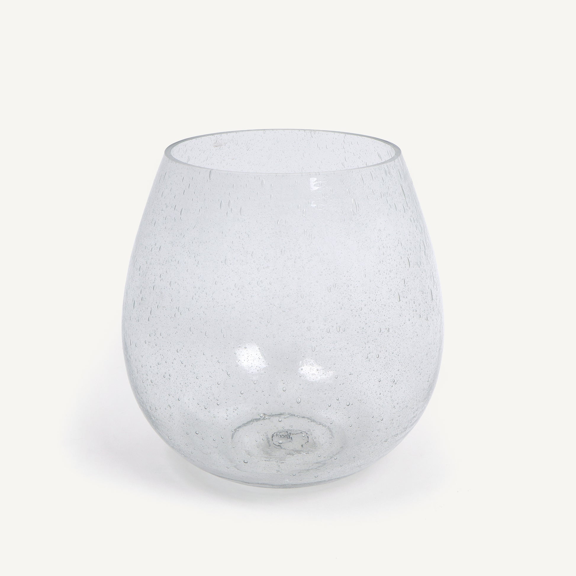 Clear glass vase with speckled pattern on a white background