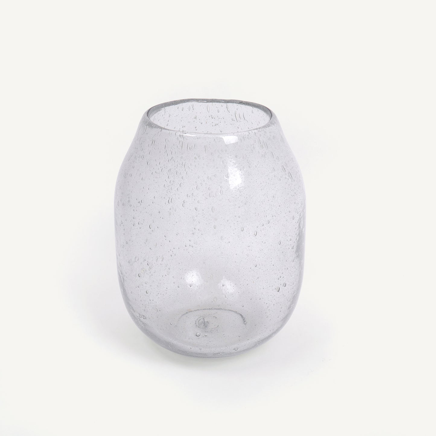 Clear glass vase with bubble texture on a white background
