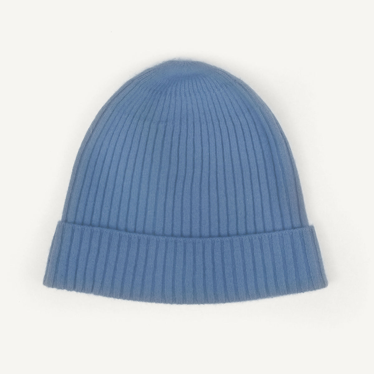 A light blue ribbed knit beanie hat with a folded cuff, shown against a plain white background.