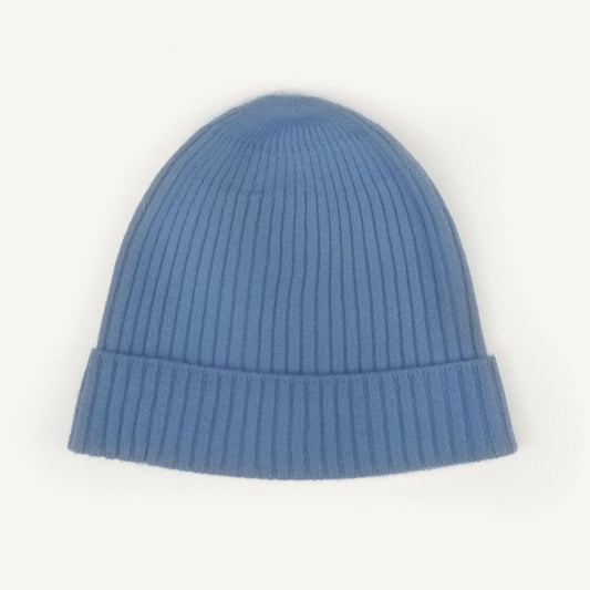 A light blue ribbed knit beanie hat with a folded cuff, shown against a plain white background.