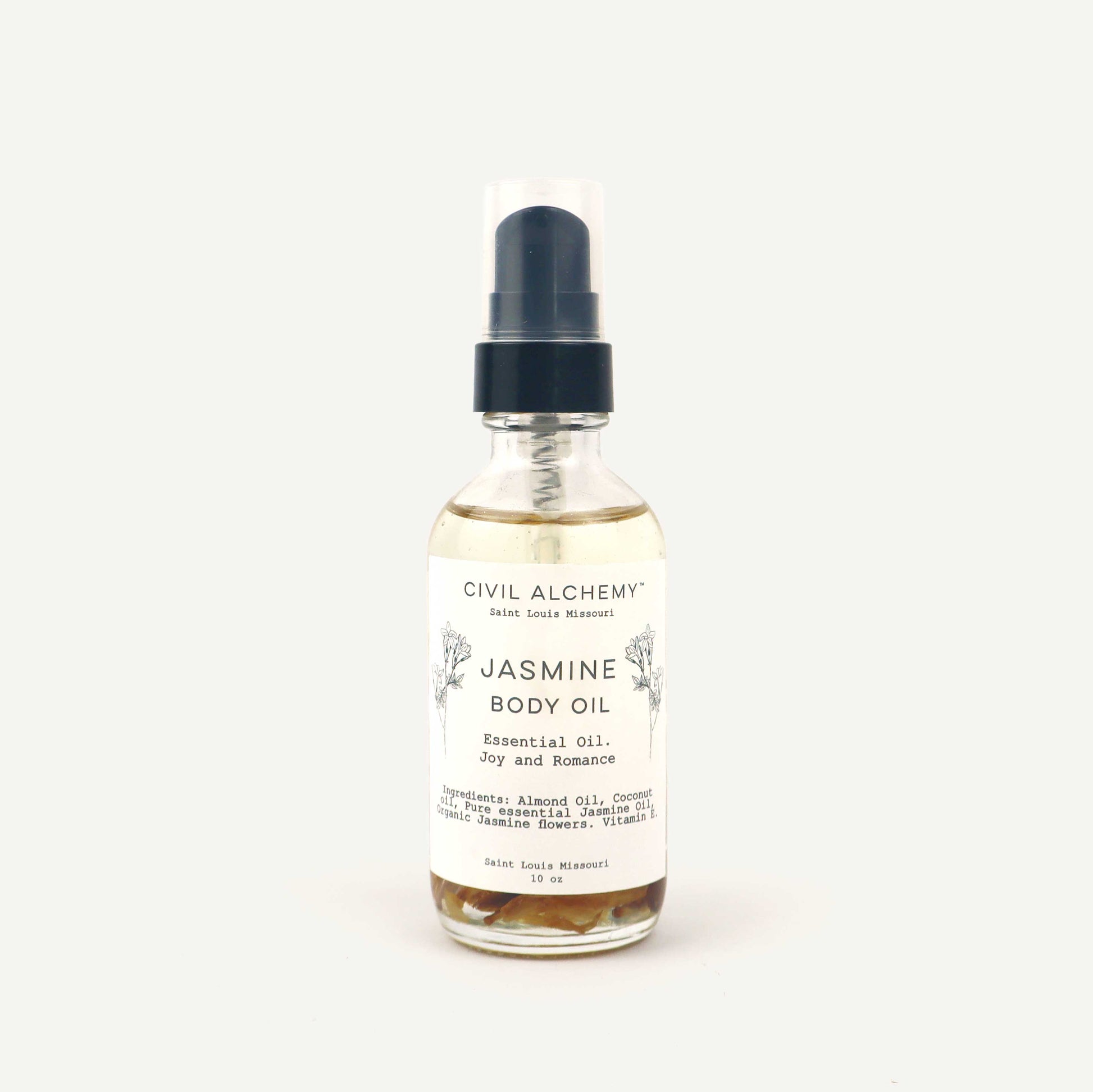 Bottle of Jasmine body oil with a label on a white background