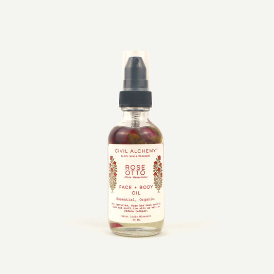 Bottle of Civil Alchemy Rose Otto face and body oil on a white background