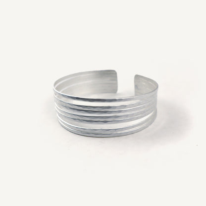 Silver bangle on a white background