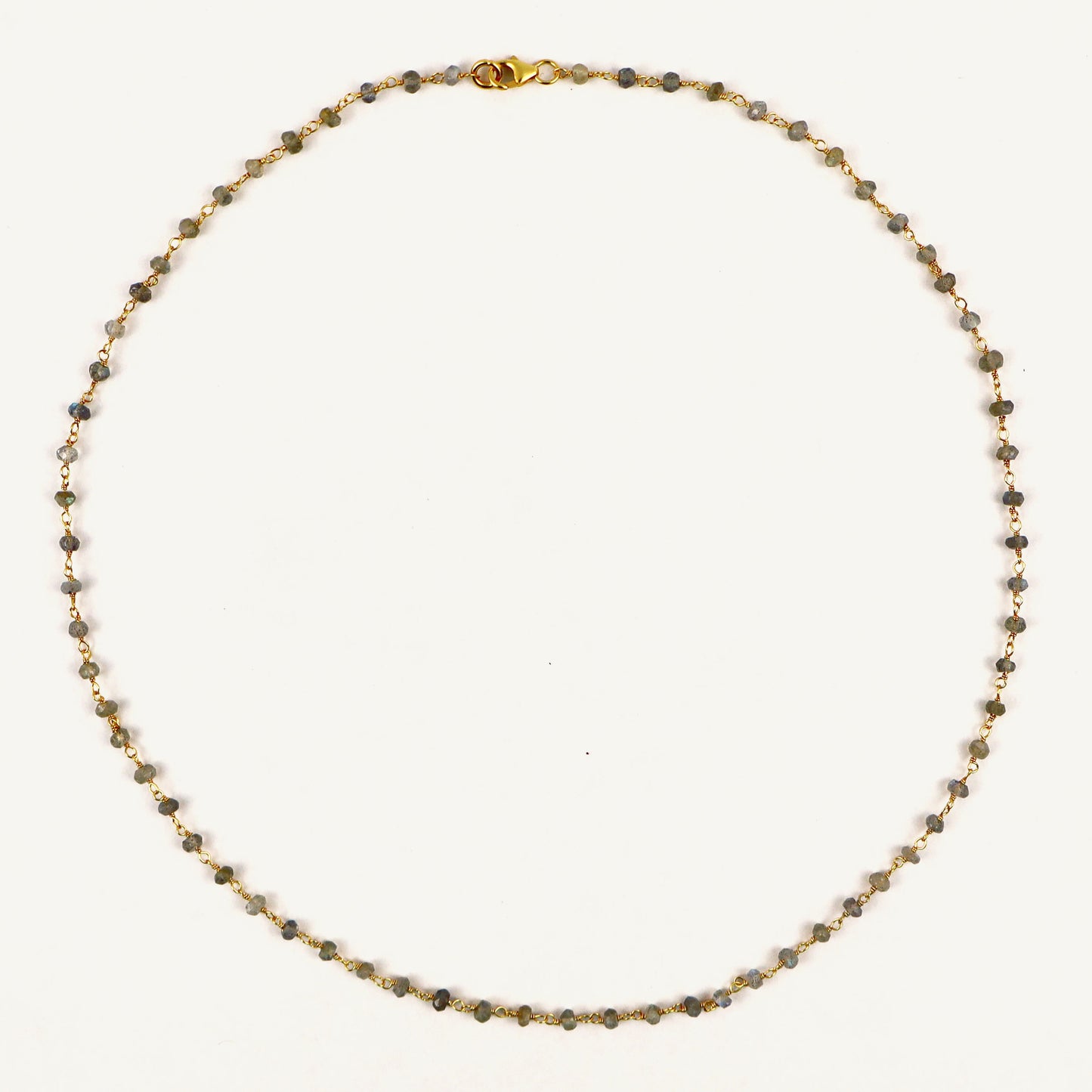 Necklace with small beads on a white background