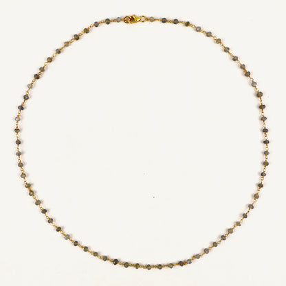 Necklace with small beads on a white background