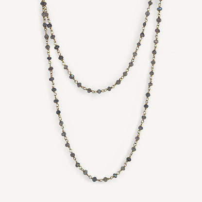 Two layered beaded necklaces on a white background