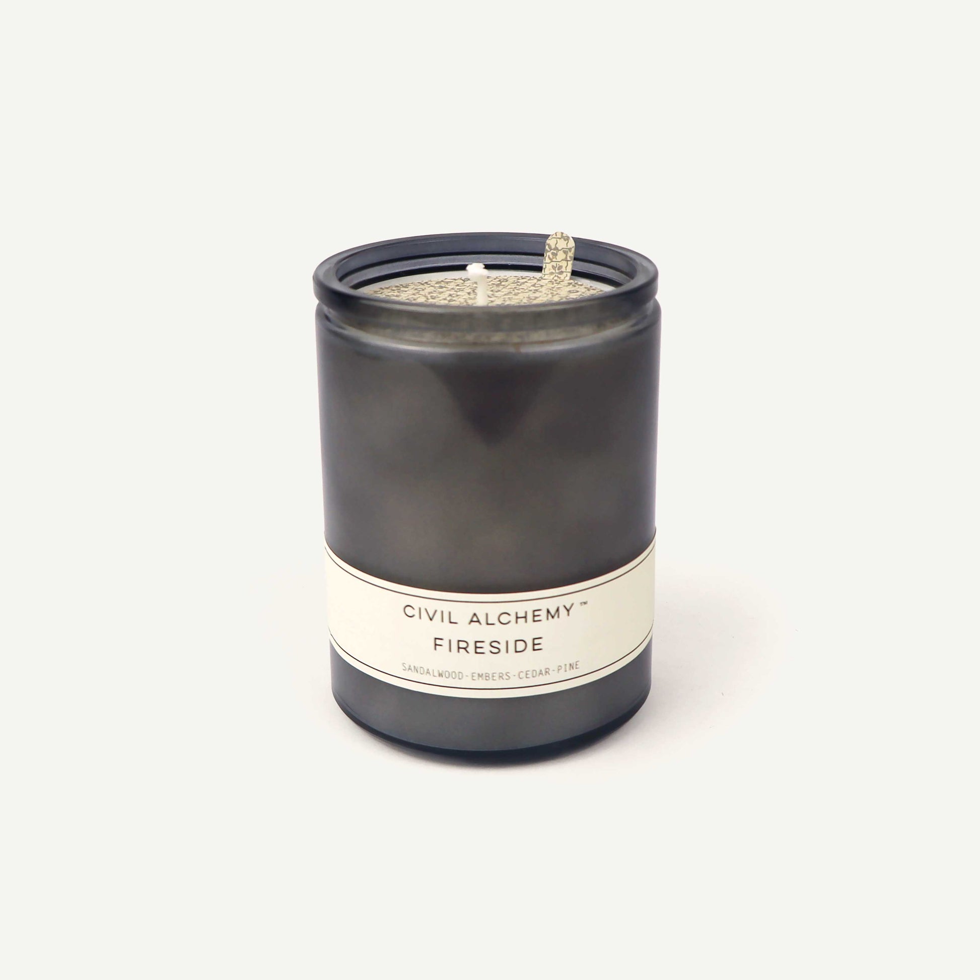 Gray candle with a label on a white background