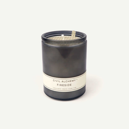 Gray candle with a label on a white background
