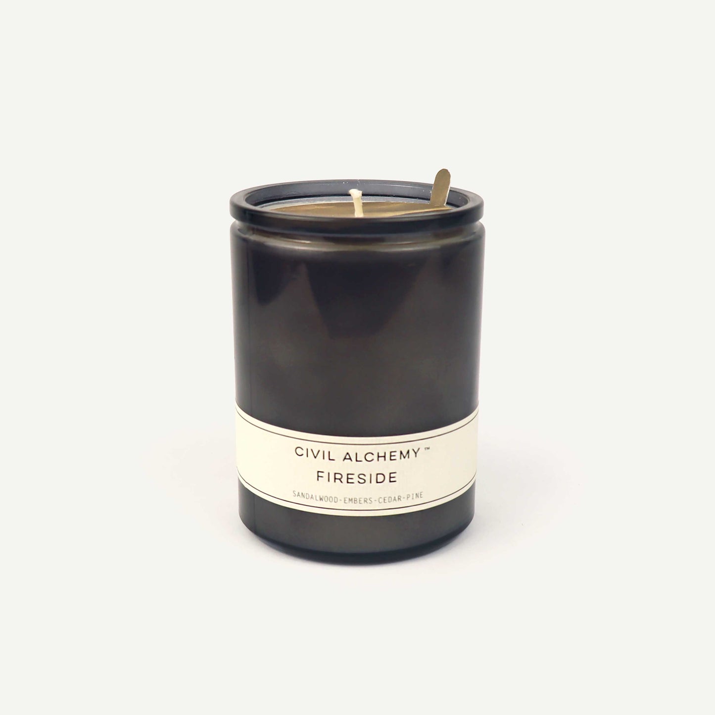 Gray candle with 'Civil Alchemy Fireside' label on a white background