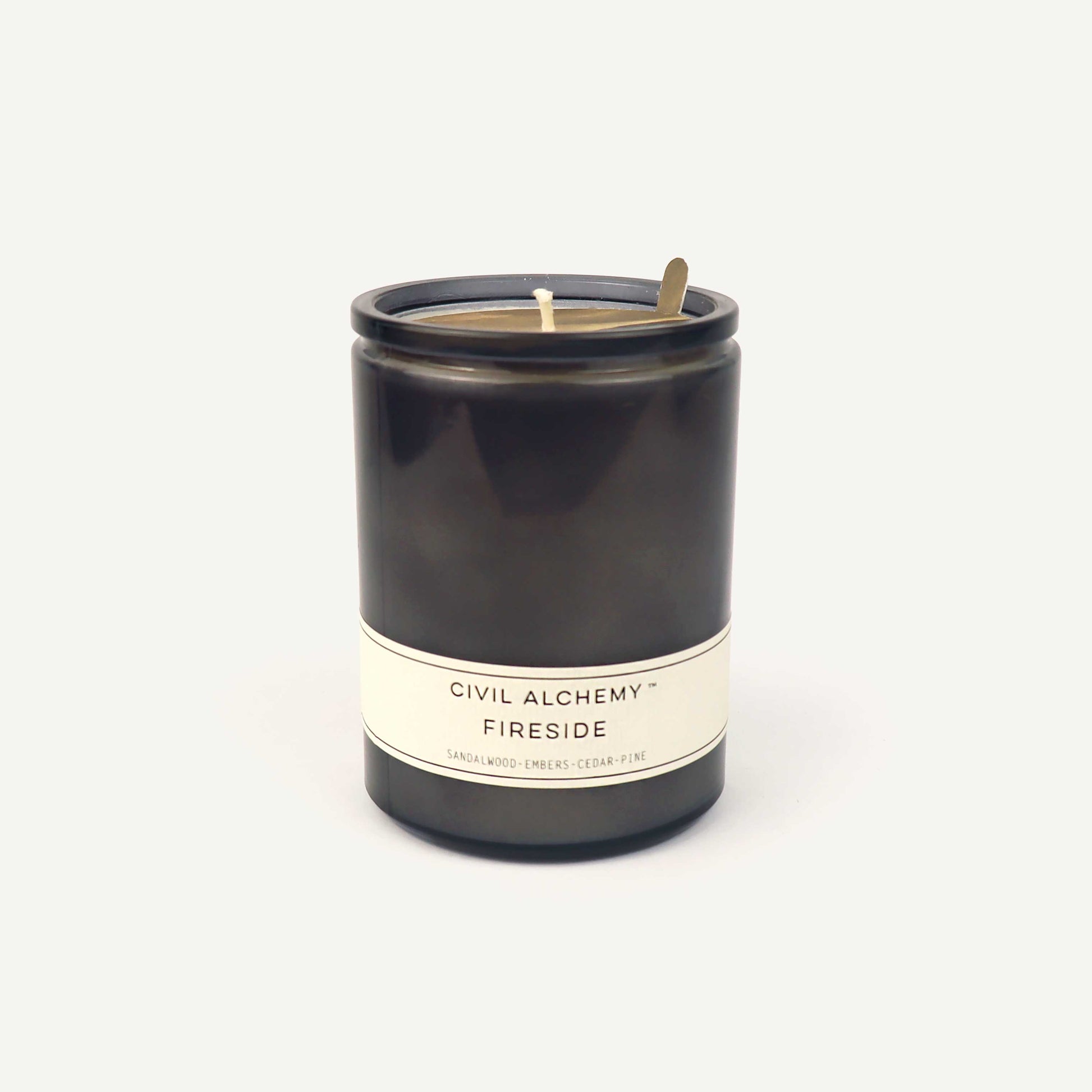 Gray candle with 'Civil Alchemy Fireside' label on a white background