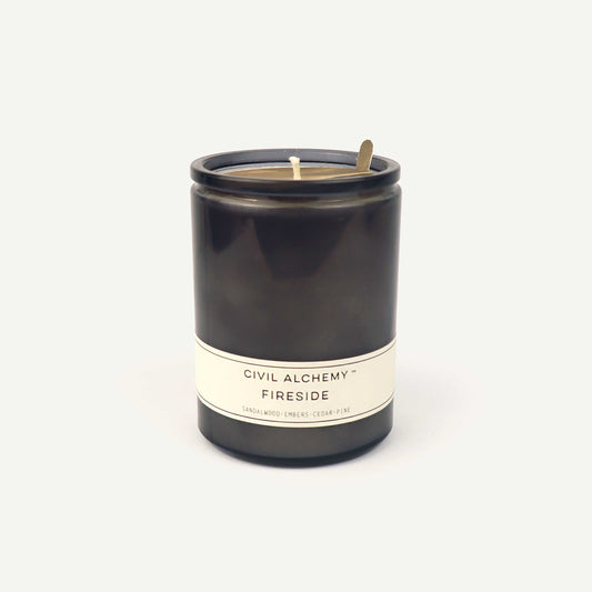 Gray candle with 'Civil Alchemy Fireside' label on a white background