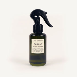 Green  spray bottle labeled 'Forest' by Civil Alchemy on a white background