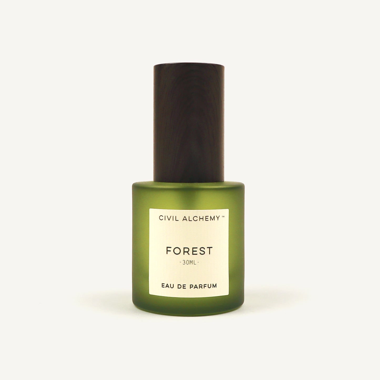 Green perfume bottle labeled 'Forest' by Civil Alchemy on a white background