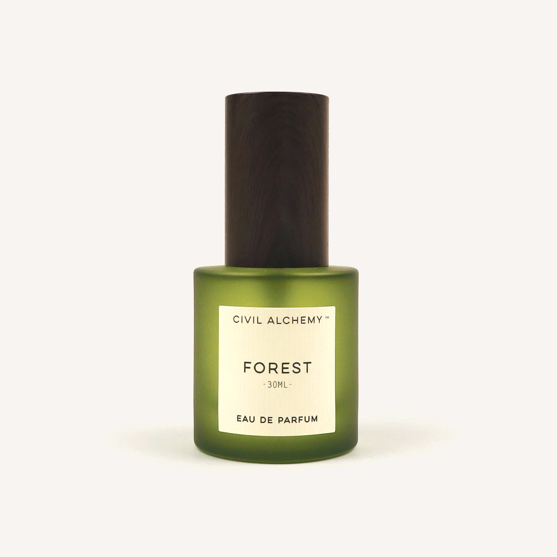Green perfume bottle labeled 'Forest' by Civil Alchemy on a white background
