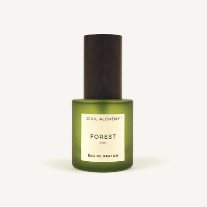 Green perfume bottle labeled 'Forest' by Civil Alchemy on a white background
