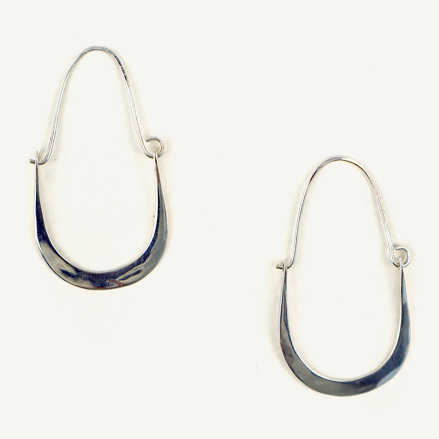 Silver hoop earrings on a white background