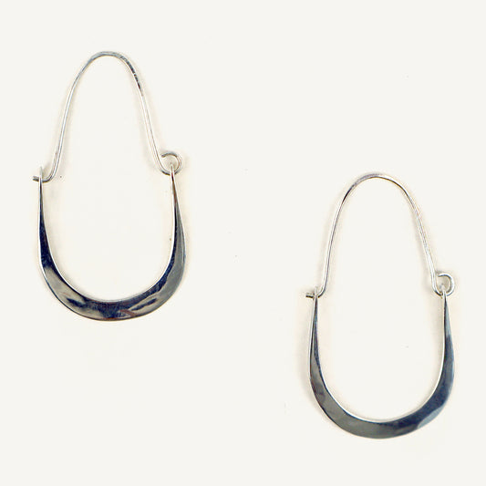 Silver hoop earrings on a white background