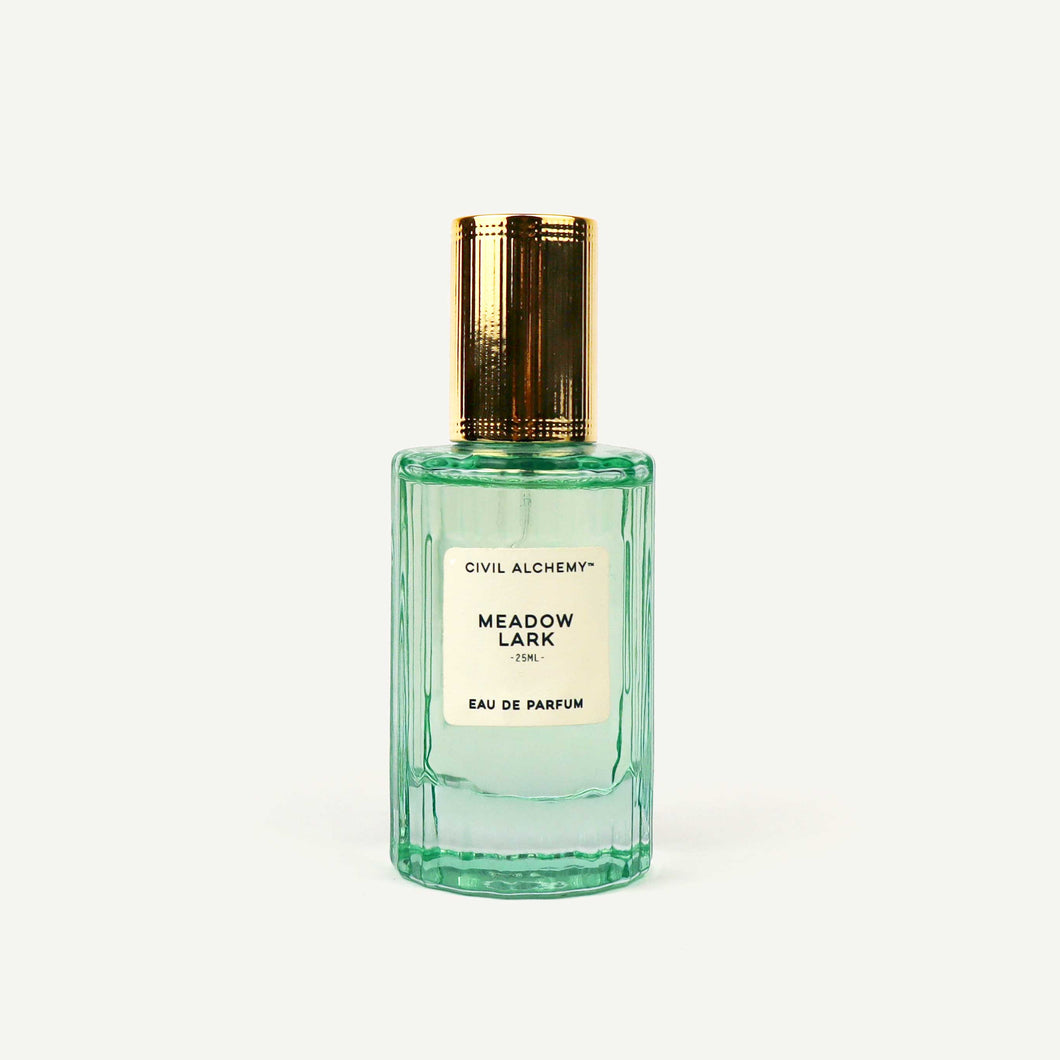 Perfume bottle labeled 'Meadow Lark' by Civil Alchemy on a white background