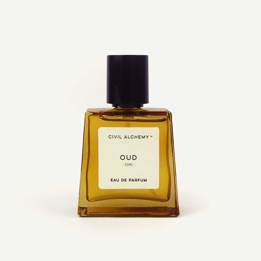 Brown perfume bottle labeled 'Oud' by Civil Alchemy on a white background