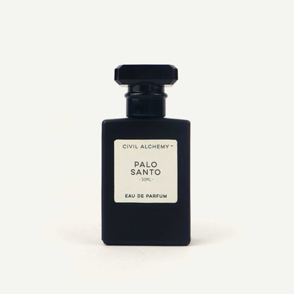 Black perfume bottle labeled 'Palo Santo' by Civil Alchemy on a white background