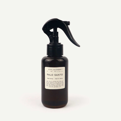 Black spray bottle labeled 'Palo Santo' by Civil Alchemy on a white background