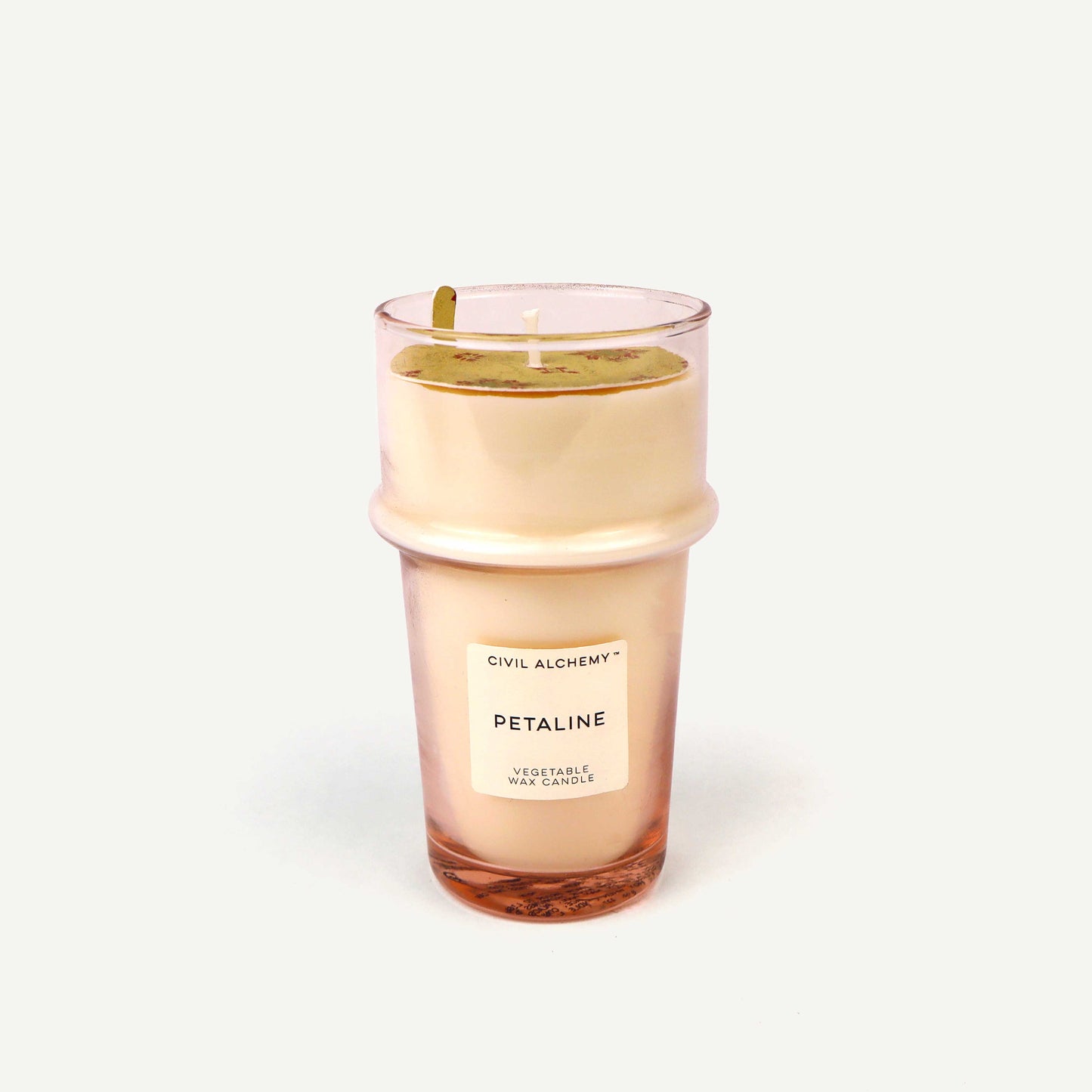 Candle in a glass container with 'Civil Alchemy' branding on a white background
