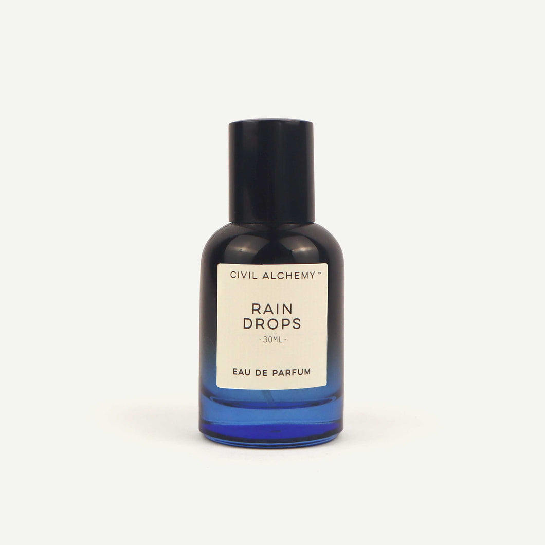 Perfume bottle labeled 'Rain Drops' by Civil Alchemy on a white background