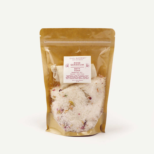 Packaged rose geranium bath soak in a clear bag with a visible label on a white background