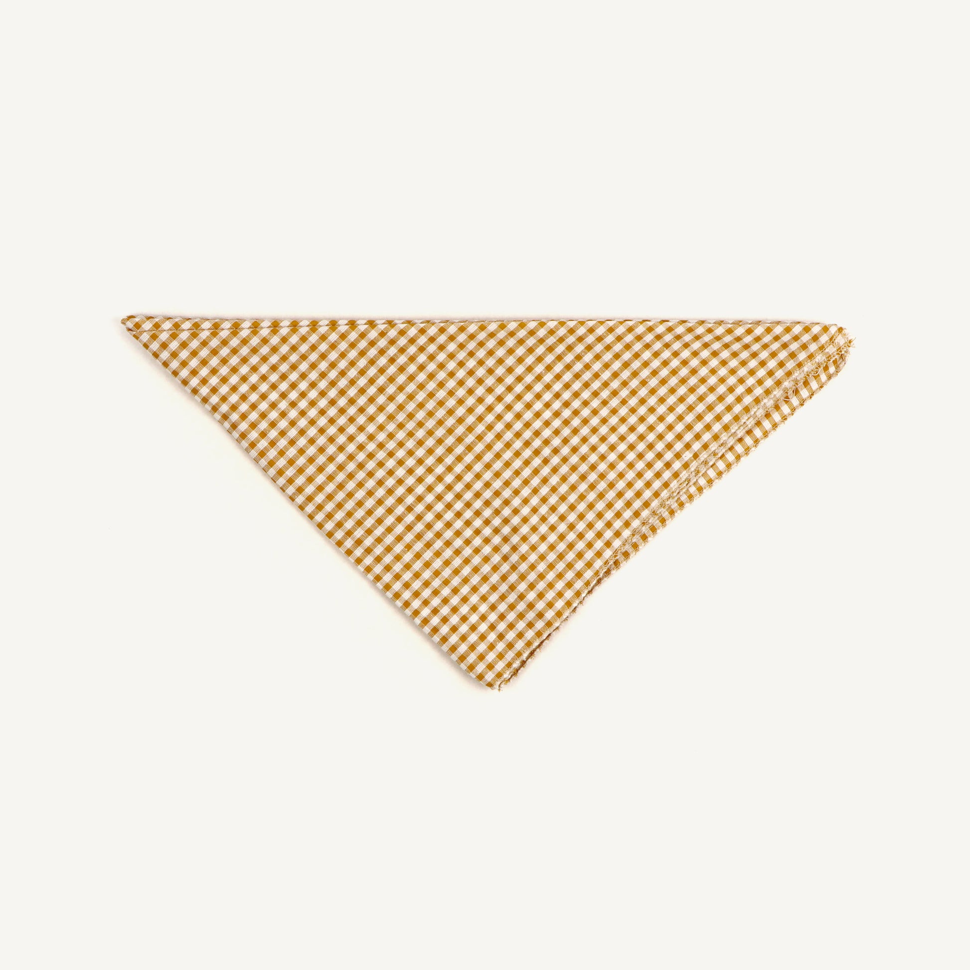 Yellow and white checkered triangle-shaped fabric on a white background