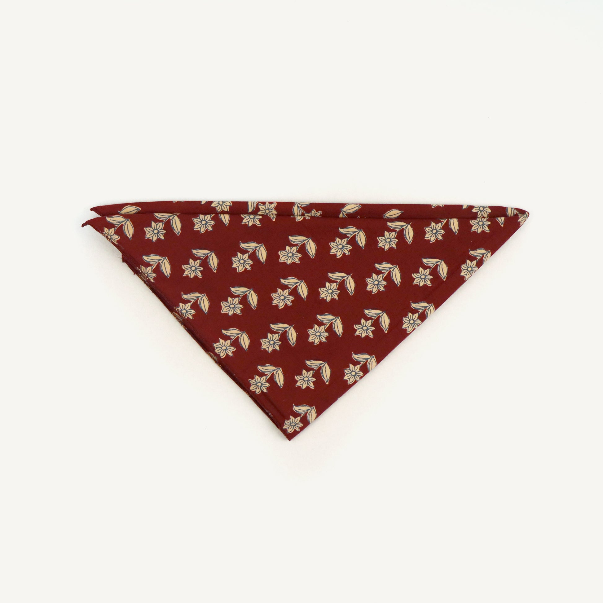 Red bandana with floral pattern on a white background