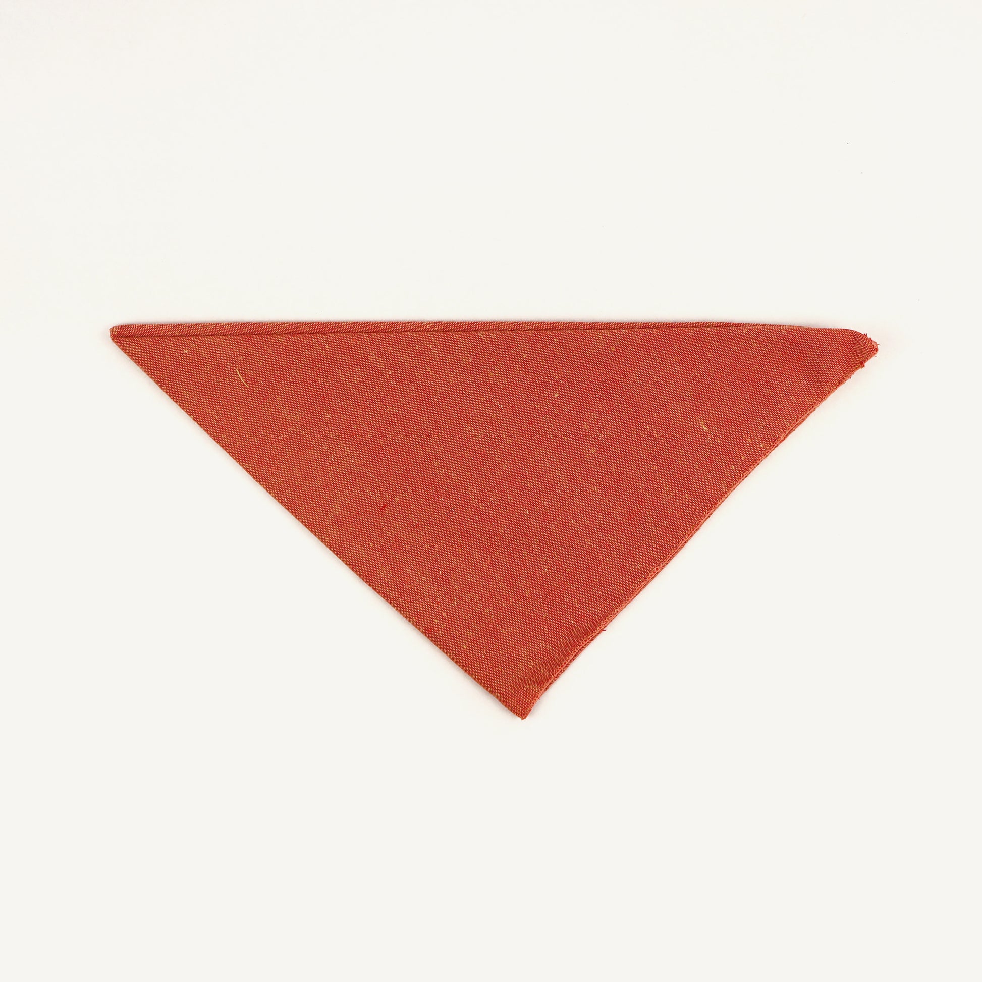 Red triangular fabric on a white background