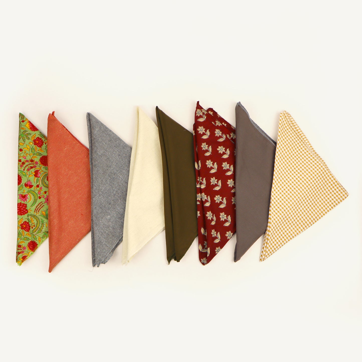 Collection of fabric swatches in various colors and patterns on a white background